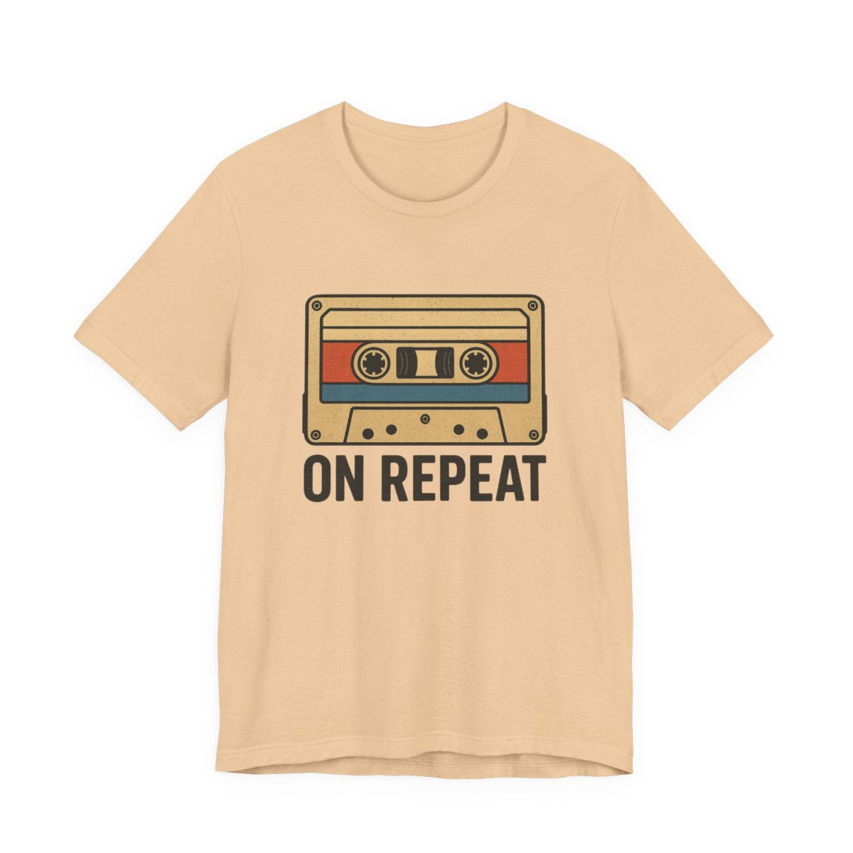 Beige t-shirt with a cassette tape graphic and 'ON REPEAT' text on a white background