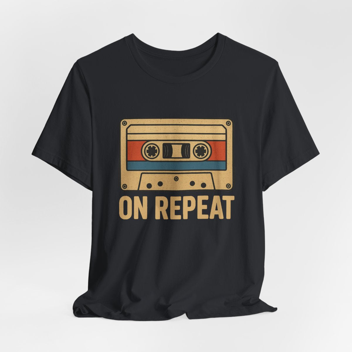 Black t-shirt with a cassette tape graphic and 'ON REPEAT' text on a white background