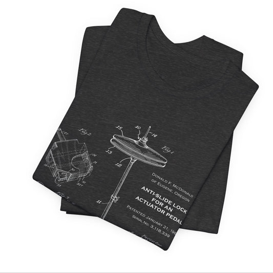 Stack of dark gray t-shirts with a white graphic design on a white background