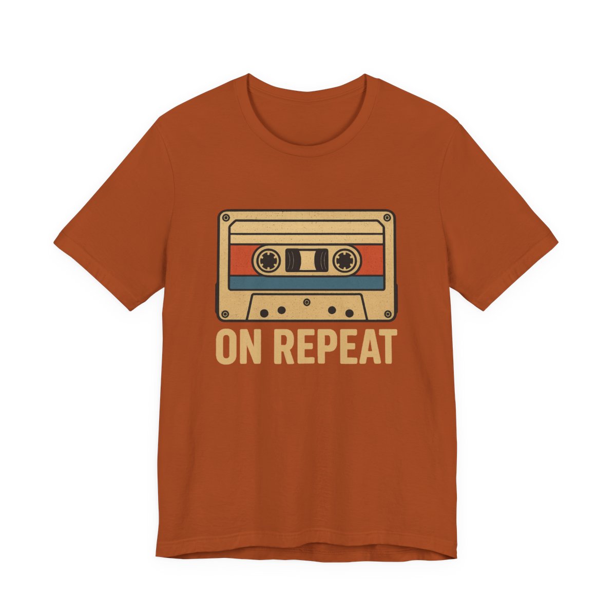 Orange t-shirt with a cassette tape graphic and 'ON REPEAT' text on a white background