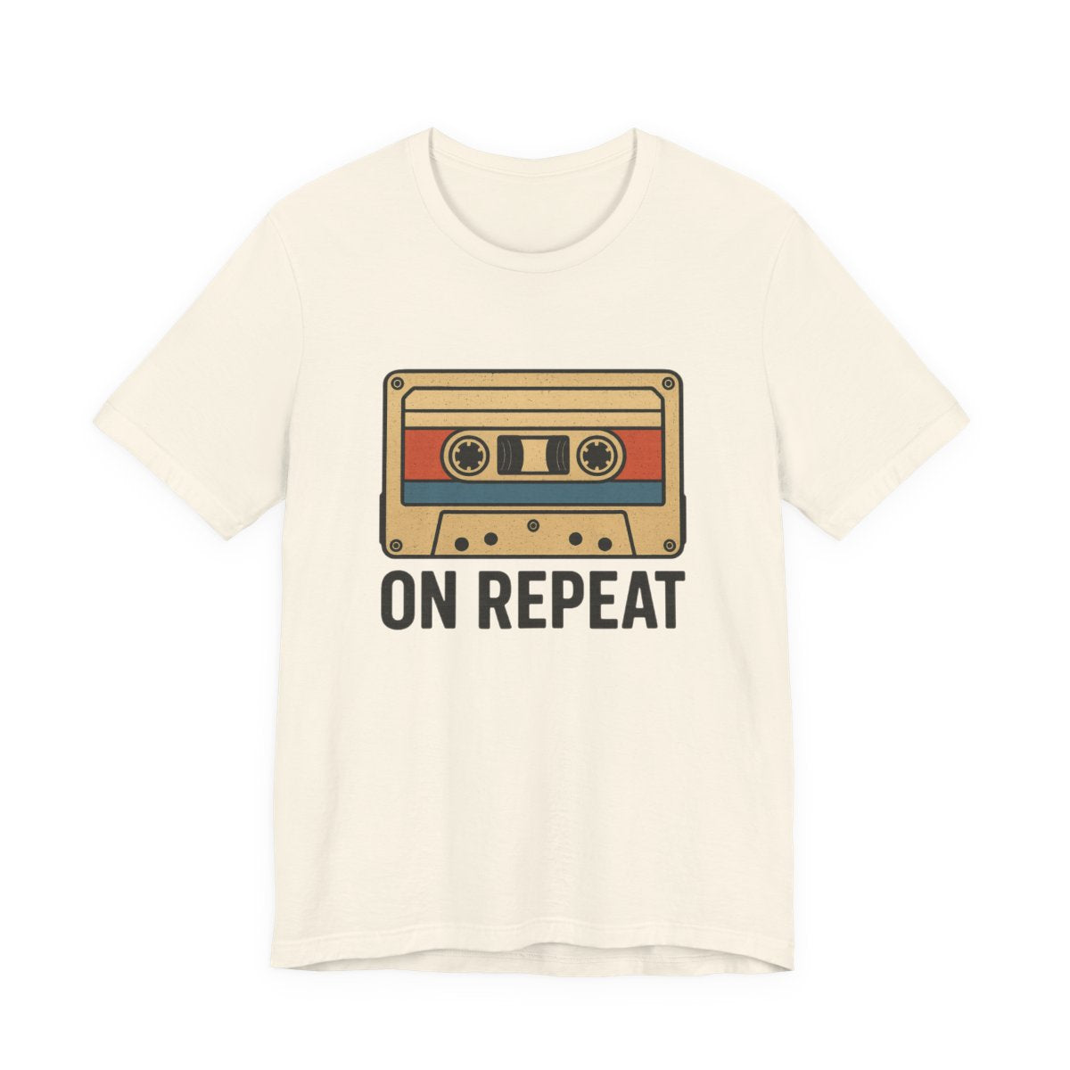White t-shirt with a cassette tape graphic and 'On Repeat' text on a white background