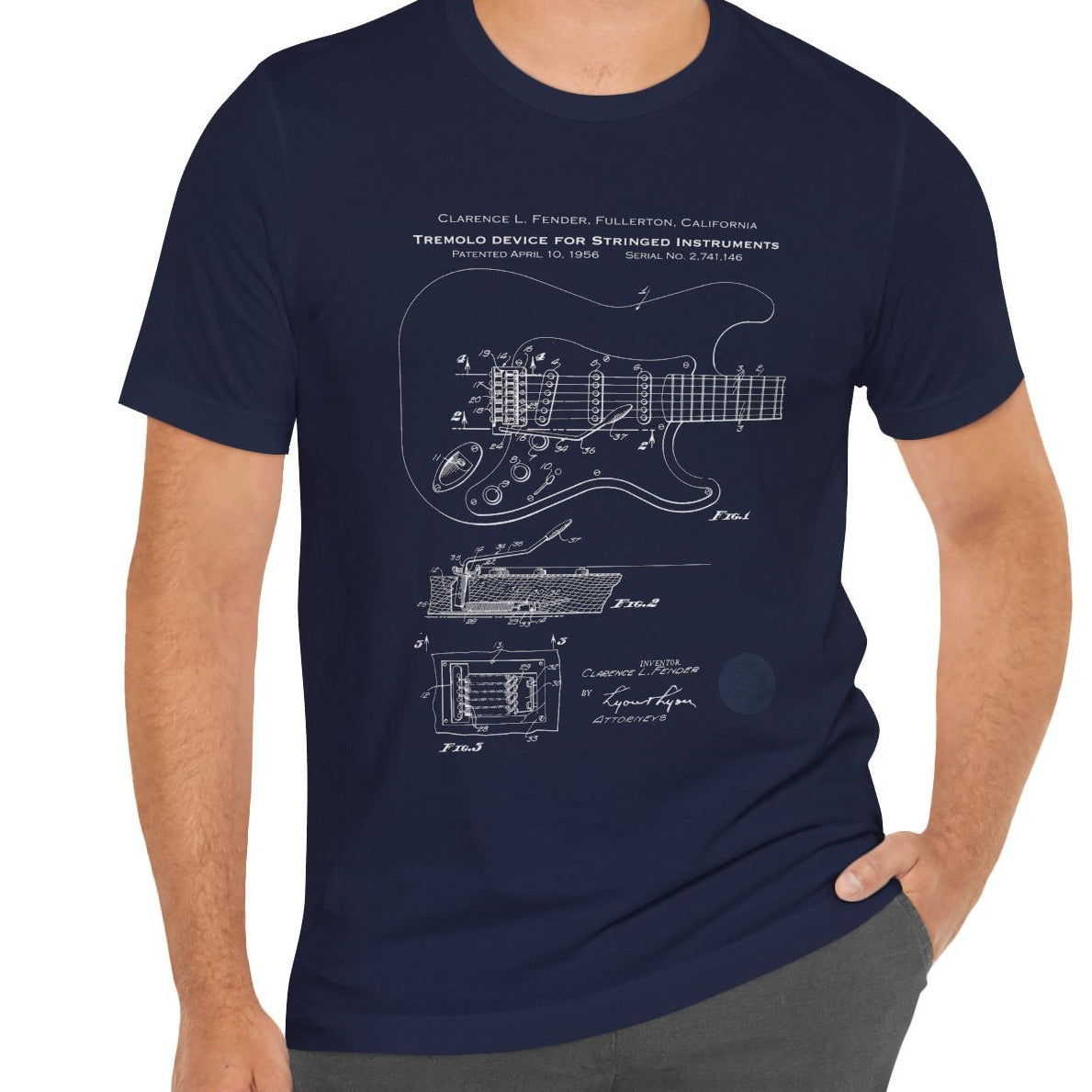 Man wearing a navy blue t-shirt with a guitar design on a white background