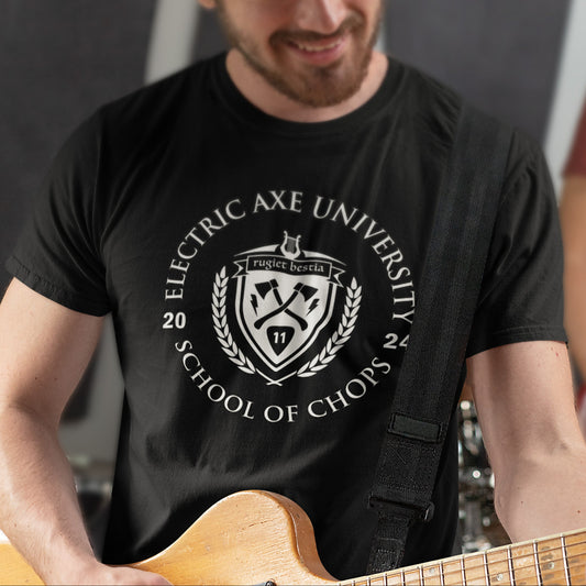 Man playing guitar wearing a black t-shirt with 'Electric Axe University' design.