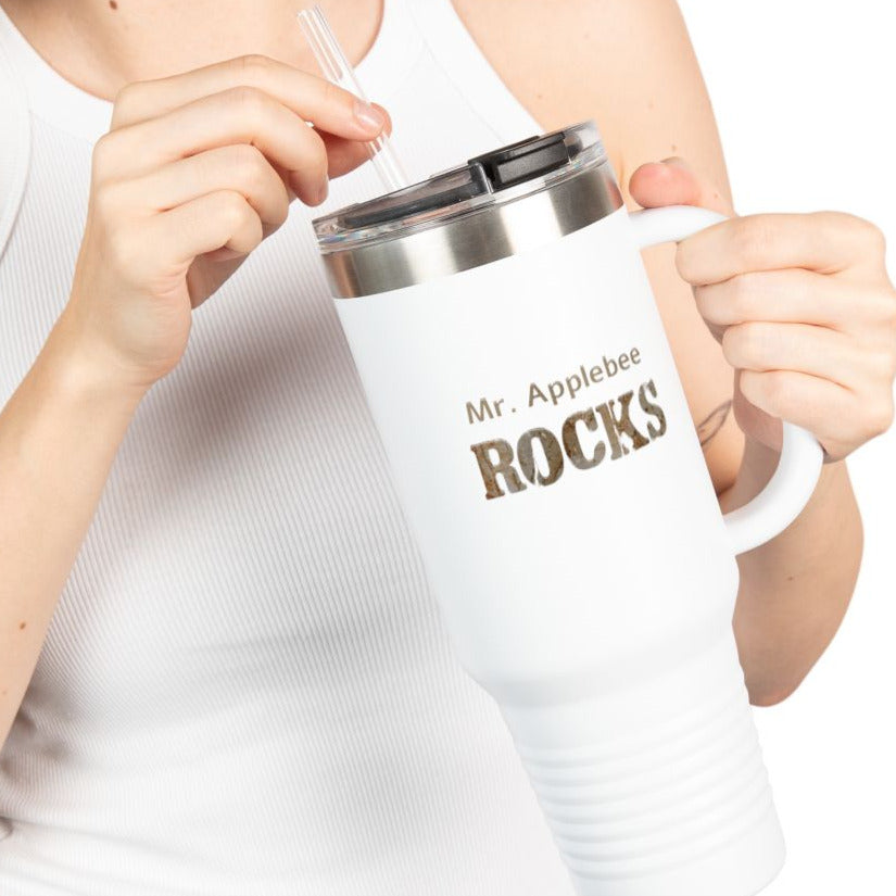 Person holding a white mug with 'Mr. Applebee ROCKS' text on a white background