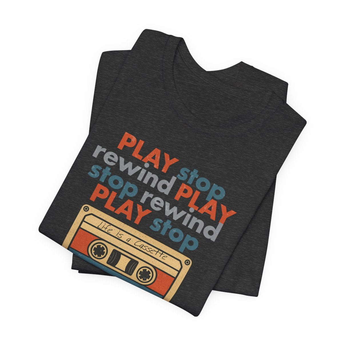 Dark gray t-shirt with colorful 'Play rewind stop' text design on a white background