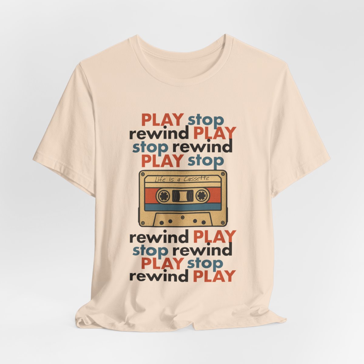 Beige t-shirt with a cassette tape graphic and text on a light gray background