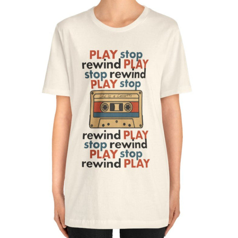 Person wearing a white t-shirt with a cassette tape graphic and text on a white background